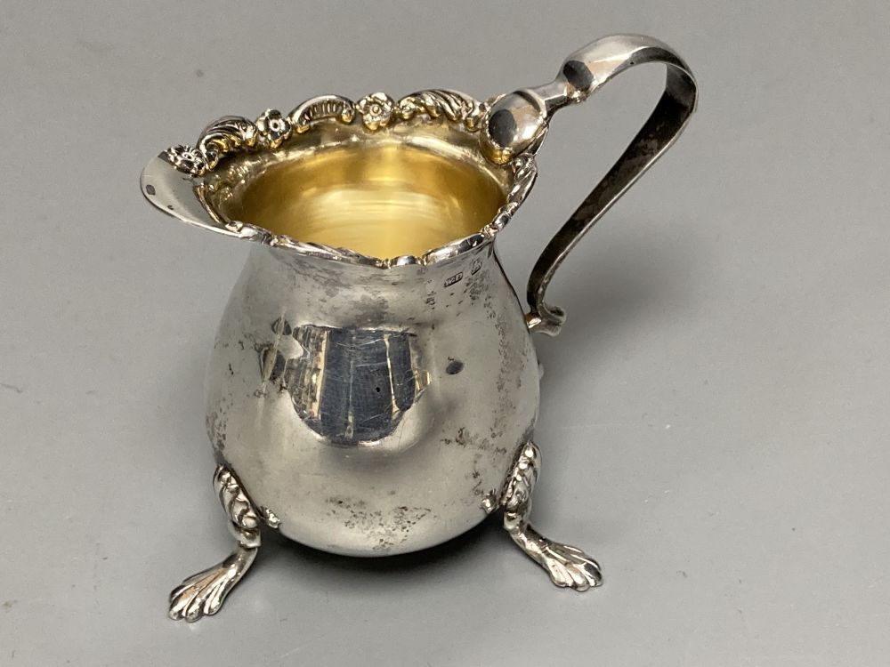 A late Victorian small silver cream jug, Birmingham, 1898, 57mm and a similar silver cream jug, London, 1891,